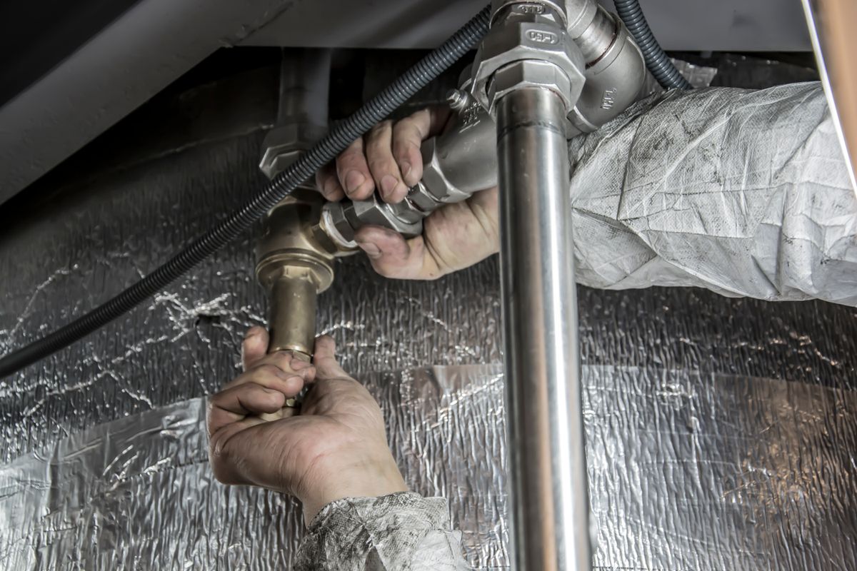 Making up new steel pipework — the kind of clean, tidy fitting behind every heating upgrade.
